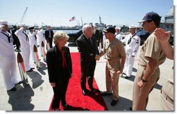 Vice President Dick Cheney and his wife Lynne Cheney is greeted by officers from the amphibious assault ship USS Bonhomme Richard. The vice president spoke to over 4,000 sailors and Marines and thanked them and their families for their service to the country. White House photo by David Bohrer