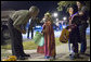 President George W. Bush shares a moment with a king during a Halloween night stop Tuesday, Oct. 31, 2006, at a housing development on base at Robins Air Force Base, Ga. White House photo by Paul Morse