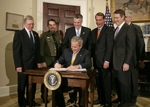 President George W. Bush signs H.R. 6061, the Secure Fence Act of 2006, in the Roosevelt Room Thursday, Oct. 26, 2006. Pictured with the President are, from left: Commissioner Ralph Basham of U.S. Customs and Border Protection; Chief David Aguilar of U.S. Customs and Border Protection; Congressman Peter King, R-N.Y.; Congressman John Boehner, R-Ohio; and Deputy Secretary Michael Jackson of the Department of Homeland Security; and Senator Bill Frist, R-Tenn. White House photo by Kimberlee Hewitt