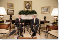 President George W. Bush meets with Andrew Natsios, U.S. Special Envoy for Sudan, in the Oval Office Monday, Oct. 2, 2006.  White House photo by Eric Draper