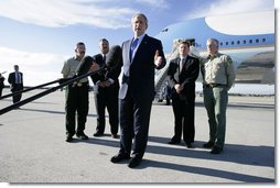 President George W. Bush stands with California forestry officials as he delivers a statement Tuesday, Oct. 3, 2006, at Los Angeles International Airport regarding the state's wildfires. The President told the crowd, "I really want to thank the brave firefighters who risk their lives on a daily basis to contain the fires." White House photo by Eric Draper