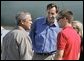 President George W. Bush meets Freedom Corps Greeter Chris Dudley, center, and Tyler Byrne, 17, at the Portland Air National Guard Base in Portland, Ore., Friday, Aug. 13, 2004. Mr. Dudley started The Dudley Foundation in 1994 to help children succeed regardless of economic, education, or health liabilities. One of the foundation's key projects is the creation of the first basketball camp for boys and girls with diabetes. Tyler takes part in the program. White House photo by Eric Draper.