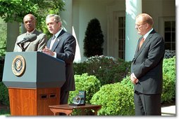 President George W. Bush and Secretary of Education Rod Paige present the 2002 Teacher of the Year award to Chauncey Veatch, right, in the Rose Garden at the White House Wednesday, April 24. Mr. Veatch is a social studies teacher at Coachella Valley High School in Thermal, Calif., White House photo by Paul Morse.