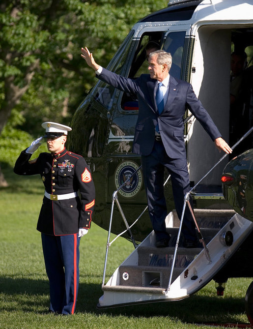 President George W. Bush waves from the steps of Marine One Tuesday, May 13, 2008 on the South Lawn of White House, as he departs on a five-day trip to Israel, Saudi Arabia and Egypt. White House photo by Eric Draper