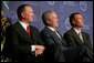 President George W. Bush shares a smile with Greensburg Schools Superintendent Darin Headrick, (left), and Greensburg High Principal Randy Fulton, during commencement ceremonies for the Greensburg High School graduating class of 2008. The town of Greensburg, KS was almost entirely destroyed when a tornado tore through the town one year ago today. White House photo by Chris Greenberg