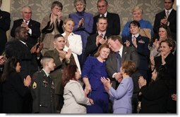 During the State of the Union Address Wednesday, Feb. 2, 2005, Janet and William Norwood, center, comfort each other as President Bush talks about their son, Marine Corps Sergeant Byron Norwood of Pflugerville, Texas, who died during the assault on Fallujah. "Ladies and gentlemen, with grateful hearts, we honor freedom's defenders, and our military families, represented here this evening by Sergeant Norwood's mom and dad, Janet and Bill Norwood," President Bush said during his speech at the U.S. Capitol.   White House photo by Eric Draper