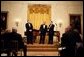 President George W. Bush thanks composer Marvin Hamlisch, left, and entertainer Mark McVey for their performance during the state dinner for the National Governors Association at the White House Sunday, Feb. 27, 2005. White House photo by Paul Morse