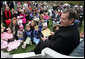 Health and Human Services Secretary Mike Leavitt prepares to read from the book, "Faux Paw's Adventures in the Internet: Keeping Children Safe," authored by his wife, Mrs. Jacalyn Leavitt, Monday, April 9, 2007, during the 2007 White House Easter Egg Roll. White House photo by David Bohrer