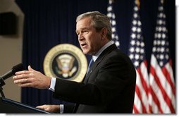President George W. Bush answers questions during a press conference in room 450 of the Eisenhower Executive Office Building on December 20, 2004.  White House photo by Paul Morse