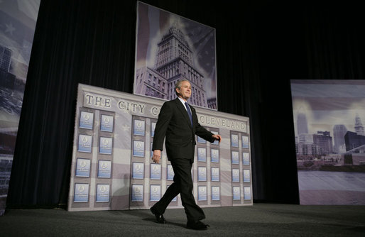 President George W. Bush walks on stage at the Renaissance Cleveland Hotel in Cleveland, Ohio, to deliver his remarks on the global war on terror, Monday, March 20, 2006, to members of the City Club of Cleveland. White House photo by Paul Morse