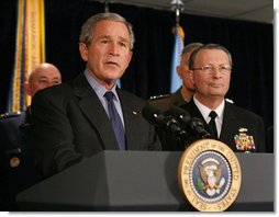 President George W. Bush answers questions from reporters following his meeting on Iraq with U.S military leaders at the Pentagon, Wednesday, Dec. 13, 2006. Admiral Edmund P. Giambastiani is seen at right.  White House photo by Eric Draper