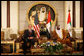 President George W. Bush and President Sheikh Khalifa bin Zayed Al Nahyan of the United Arab Emirates sit under a painting of the Sheikh's father, Sheikh Zayed bin Sultan Al Nahyan, during arrival ceremonies Sunday, Jan. 13, 2008, at Al Mushref Palace in Abu Dhabi. White House photo by Eric Draper