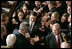 A flock of hands reach for President Bush as he signs his autograph after delivering the State of the Union Address in the House Chamber at the U.S. Capitol Tuesday, Jan. 23, 2007.