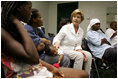 Laura Bush visits with people affected by Hurricane Katrina in the Cajundome at the University of Louisiana in Lafayette, La., Friday, Sept. 2, 2005.