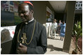 Led by Polycarp Cardinal Pengo, Laura Bush tours PASADA with Madame Anna Mkapa in Dar es Salaam, Tanzania, Wednesday, July 13, 2005. “For 13 years, the people of PASADA have provided services to men, women and children, whether they are infected with HIV or not. PASADA provides health education in communities, teaching teens and adults about the risks of HIV transmission,” said Mrs. Bush in her remarks. 