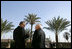 Vice President Dick Cheney speaks with Zalmay Khalilzad, US Ambassador to Iraq, inside the Green Zone, Sunday Dec. 18, 2005.
