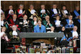 Mrs. Laura Bush is applauded as she addresses the audience at the University of Turin in Turin, Italy, Feb. 11, 2006, where she announced a U.S. book donation to the university.