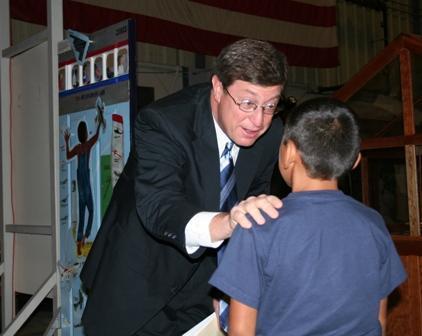 Congressman Chandler speaks with a student after the annual Military Academy Day on September 8, 2007, at the Aviation Museum of Kentucky in Lexington.