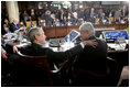 President George W. Bush shares a moment Saturday, Nov. 5, 2005, with President Alfredo Palacio of Ecuador during the final session of the 2005 Summit of the Americas in Mar del Plata, Argentina.