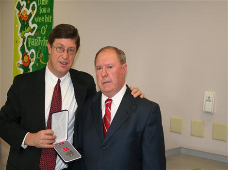 Congressman Chandler      presents medals to Vietnam War veteran, Sergeant William B. Stevens, at the Scott County Senior Citizens Center on March 10, 2008