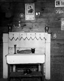 Fireplace and wall details in a bedroom in the home of Floyd Burroughs, cotton sharecropper, Hale County, Alabama