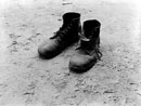The work boots of Foyd Burroughs, cotton sharecropper, Hale County, Alabama