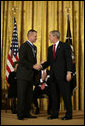 President George W. Bush shakes hands with General Peter Pace after presenting him with the Presidential Medal of Freedom Thursday, June 19, 2008, during the Presidential Medal of Freedom ceremony in the East Room at the White House. White House photo by David Bohrer