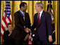 President George W. Bush shakes hands with Dr. Benjamin Carson Thursday, June 19, 2008, after presenting him with the 2008 Presidential Medal of Freedom during ceremonies in the East Room of the White House. White House photo by David Bohrer