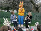 Mrs. Laura Bush, joined by her daughter, Jenna, applauds the PBS character "Arthur," following the reading of "Arthur Meets the President," Monday, March 24, 2008, during festivities at the 2008 White House Easter Egg Roll on the South Lawn of the White House. White House photo by Patrick Tierney