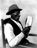 A Man Reading the Story of Harper's Ferry