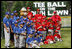 Teams participating in the opening game of the 2008 Tee Ball on the South Lawn, the Cramer Hill Little League Red Sox of Camden, N.J., and the Jose M. Rodriguez Little League Angels of Manatí, Puerto Rico, pose together Monday, June 30, 2008, for a photo on the South Lawn of the White House.