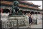 Mrs. Laura Bush and daughter Barbara Bush pause next to a Fu Dog during a visit Friday, Aug. 9, 2008, to the Forbidden City in Beijing. White House photo by Shealah Craighead