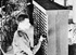 A man using the ENIAC computer.