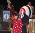 Gordon Yellowman, a Cheyenne Peace Chief, performs a sage blessing at the beginning of the conference, along with his daughter, Cricket.