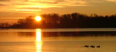 Sunrise over a calm river