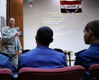 Capt. Tom Fiordelisi, an air adviser with the 321st Air Expeditionary Training Group, instructs situational leadership to Iraqi Air Force cadets at Forward Operating Base Rustamiyah, Iraq, Nov. 10, 2008.  Photo by Staff Sgt. Paul Villanueva II, Baghdad Media Outreach Team.