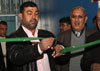 Muhammad Madlom, Neighborhood Advisory Council chairman, cuts a ribbon, Jan. 9, to commemorate the reopening of the newly renovated Talaba Sports Complex, which is located in the Qahira neighborhood of the Adhamiyah District of Baghdad.  Photo by Sgt. Whitney Houston, 4th Infantry Division Public Affairs.