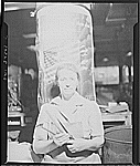 A Polish mother who works on a drill press machine at the Landers, Frary, and Clark plant, New Britain, Conn.