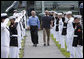 President George W. Bush walks with Crown Prince Sheikh Mohammed bin Zayed Al Nahyan of Abu Dhabi, UAE, through an honor guard upon his arrival to Camp David, Thursday, June 26, 2008 in Camp David, Md. White House photo by Eric Draper