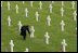 Mrs. Laura Bush lays flowers at the Netherlands American Cemetery Sunday, May 8, 2005, in Margraten.