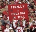 An Arizona Cardinals fan holds up a sign that reads \