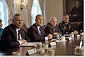Accompanied by Secretary of State Colin Powell, far left, Vice President Dick Cheney and Chairman of the Joint Chiefs of Staff Hugh Shelton (far right), President George W. Bush talks with the press about the previous day's terrorist attacks during a cabinet meeting Sept. 12, 2001. White House photo by Tina Hager