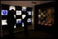 Mrs. Laura Bush, joined by Russell Caldwell, manager of visitor services at the Margaret Mitchell House and Museum in Atlanta, Ga., looks at a photo display showing images from the 1939 movie premiere of Gone with the Wind, during a tour of the famous author’s home, Thursday, Nov. 1, 2007. White House photo by Shealah Craighead