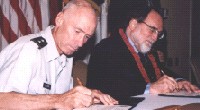 Congressman Neil Abercrombie and Major General Eric T. Olson sign public-private partnership agreement for Army housing on September 13, 2003. The groundbreaking agreement to replace and renovate 7,700 Army housing units on Oahu will create thousands of jobs and generate $6.9 billion for Hawaii's economy over a 50 year period. (press release)