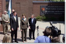 Mrs. Laura Bush joined by, from left, U.S.Rep. Mike Turner and U.S. Sen. Mike DeWine talk to the press after touring Wright-Dunbar Village in Dayton, Ohio, Wednesday, August 16, 2006. The Village is a Preserve America neighborhood that is home to the historic sites where the Wright brothers worked on the inventions that led to flight and Paul Laurence Dunbar printed his newspaper.  White House photo by Shealah Craighead