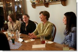 Mrs. Laura Bush shares in laughter with girls who are living in a family-style residential group home at Father Flanagan’s Girls & Boys Town in Omaha, NE, Monday, April 3, 2006. Girls and Boys Town was founded in 1917 to help troubled boys. Today there are more than 100 long-term, residential-care homes for trouble youths, featuring family-style living in the least restrictive environment. White House photo by Shealah Craighead