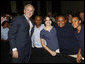 President George W. Bush poses with a group of students Thursday, Jan. 8, 2009, following his address at the General Philip Kearny School in Philadelphia, where President Bush spoke about the success of the No Child Left Behind Act and urged Congress to strenghten and reauthorize the legislation. White House photo by Chris Greenberg