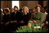 Hosting the Mark Twain Symposium, Laura Bush sits with Patricia Rowland and documentary filmmaker Ken Burns, in the East Room Nov. 29, 2001.