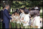 President George W. Bush is joined by South Korean President, Lee Myung-bak, as he greets children during his visit to the Blue House Wednesday, Aug. 6, 2008, in Seoul. White House photo by Eric Draper