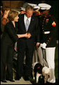 Mrs. Bush greets participants of the Evening Parade at the Marine Barracks, Friday, August 29, 2008 in Washington DC, as President George W. Bush looks down at the official barracks mascot, Chesty. White House photo by Joyce N. Boghosian